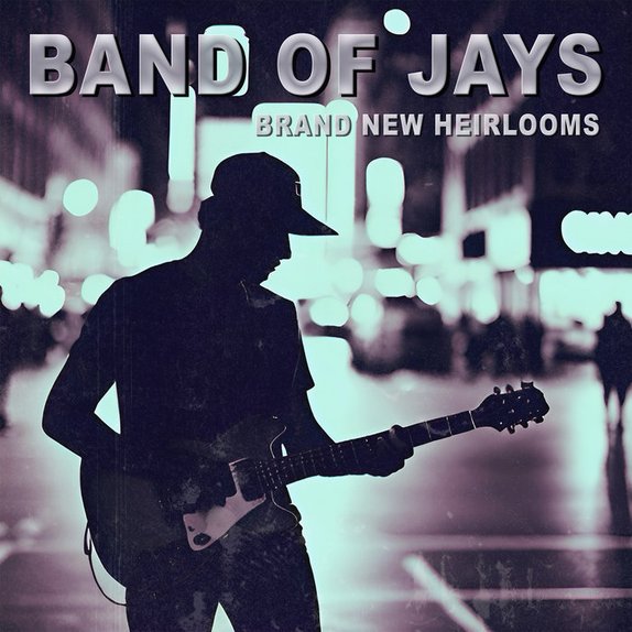 Brand New Heirlooms — cover art. A guitarist in a ball cap silhouetted against a blurred, teal-tinted city street at night.