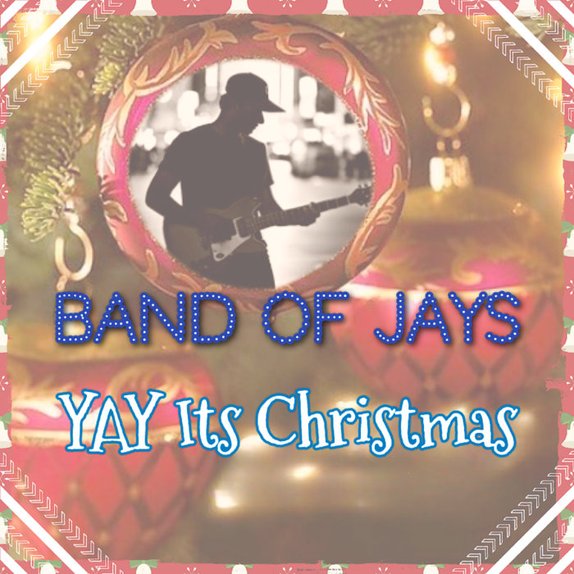 Yay It's Christmas — cover art. A guitarist silhouetted inside the reflection on a red glass Christmas ornament, framed by holiday ribbon.