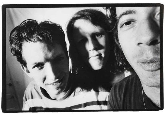 James and the Giant Peach — the three band members posed close together for a black-and-white photo, faces overlapping toward the camera.